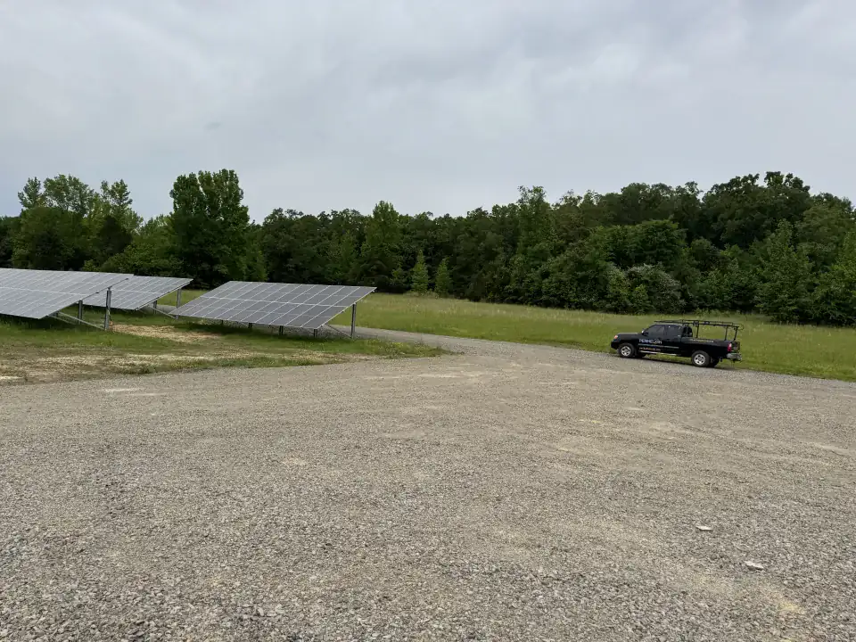 Ground-mounted panels and a Perihelion truck at the City of Morrilton solar array
