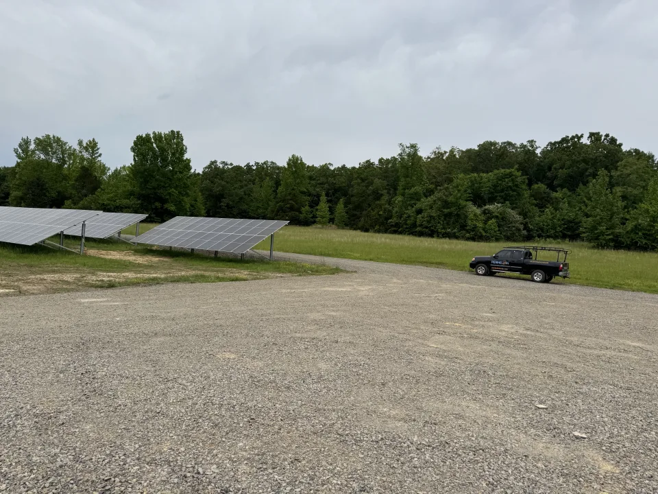 Ground-mounted panels and a Perihelion truck at the City of Morrilton solar array